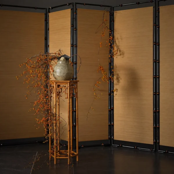 Hexagonal Bamboo Plant Stand with Key-Fret Apron in clay — in a room setting