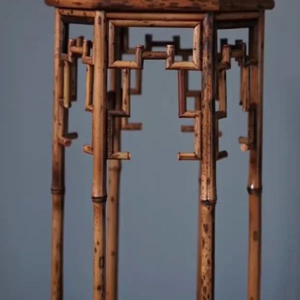 Hexagonal Bamboo Plant Stand with Key-Fret Apron in clay — detail