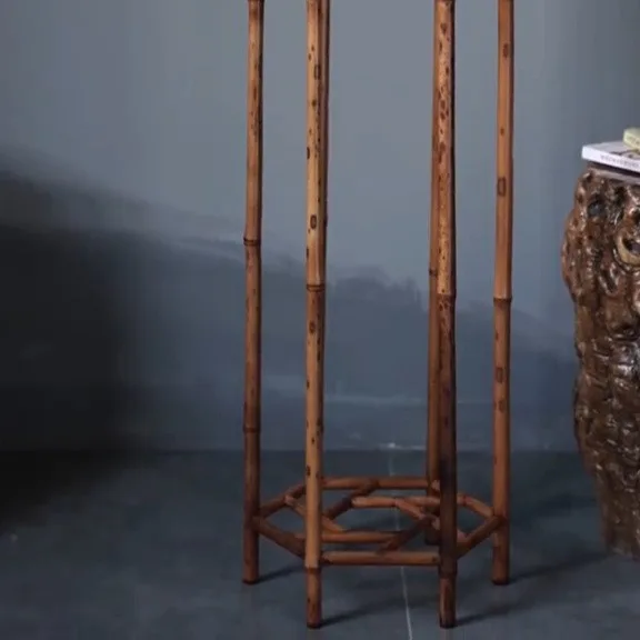 Hexagonal Bamboo Plant Stand with Key-Fret Apron in clay — detail