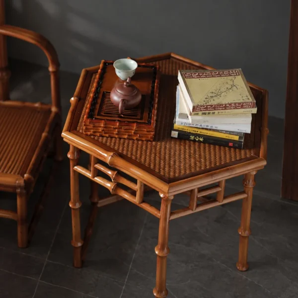 Hexagonal Bamboo Side Table with Lattice Apron in clay — in a room setting