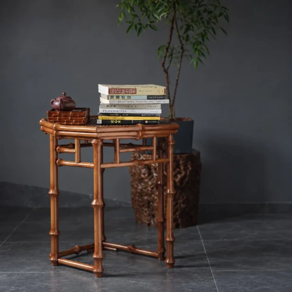 Hexagonal Bamboo Side Table with Lattice Apron in clay — in a room setting