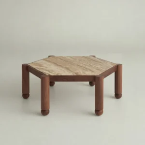 Hexagonal Travertine Coffee Table on Walnut Ball-Foot Legs in sand — front view