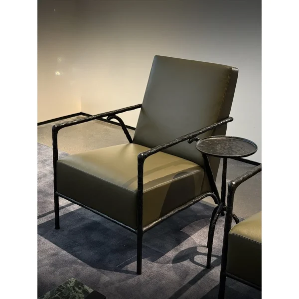 Forged Bronze Frame Lounge Chair in black — in a room setting