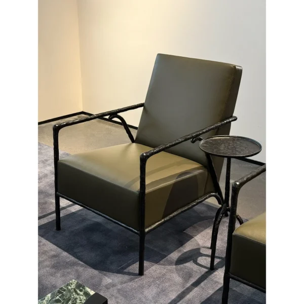 Forged Bronze Frame Lounge Chair in black — in a room setting