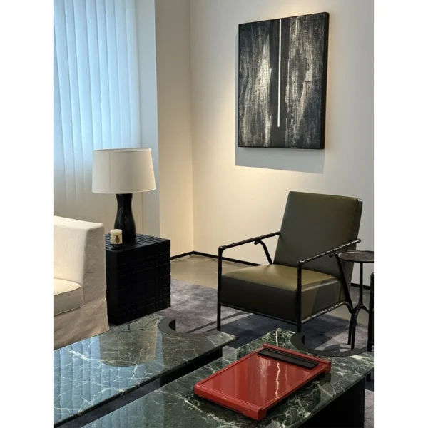 Forged Bronze Frame Lounge Chair in black — in a room setting