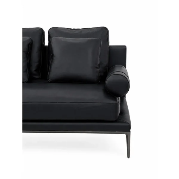 High-Leg Sofa in Black Leather with Cylinder Arms on Slim — in a room setting
