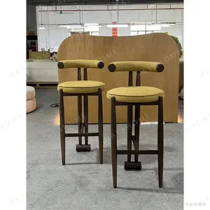 Walnut Bar Stool with Mustard Bouclé Seat and Bolster Back in walnut — in a room setting