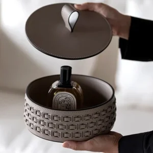Woven Leather Round Lidded Jewellery Box in slate — in a room setting