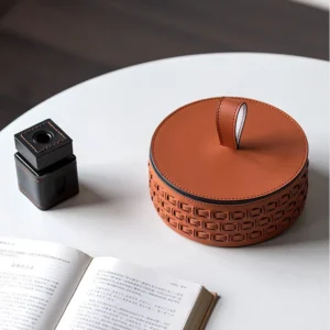 Woven Leather Round Lidded Jewellery Box in slate — in a room setting