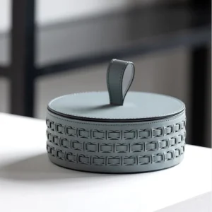 Woven Leather Round Lidded Jewellery Box in slate — in a room setting