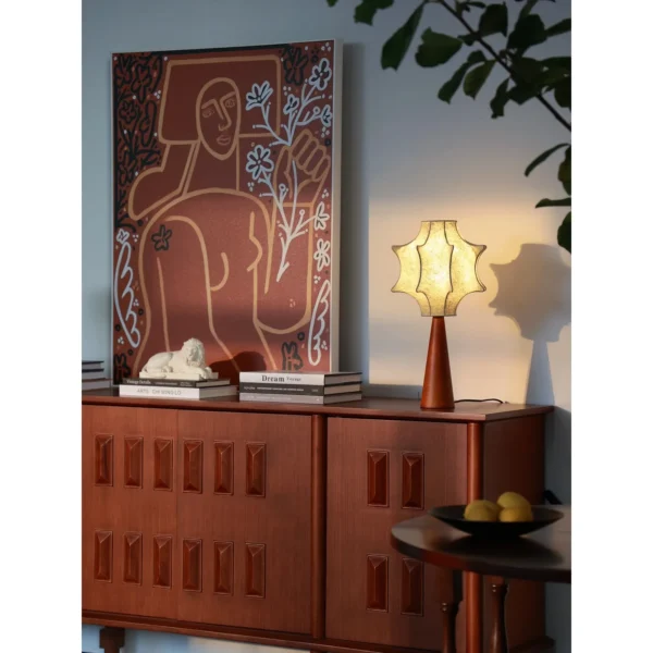 Pleated Paper Star Shade Table Lamp on Wood Base in oatmeal — in a room setting