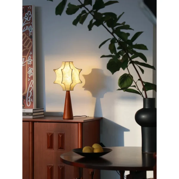 Pleated Paper Star Shade Table Lamp on Wood Base in oatmeal — in a room setting