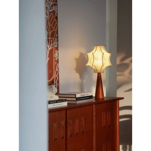 Pleated Paper Star Shade Table Lamp on Wood Base in oatmeal — in a room setting