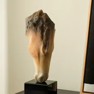 Inverted Horse Head Fragment Sculpture in sand — front view