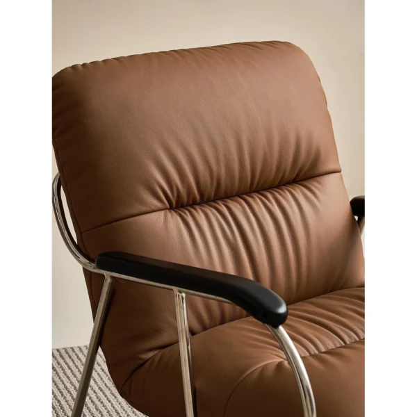 S-Curve Lounge Chair in Cognac Leather on Steel Frame — in a room setting