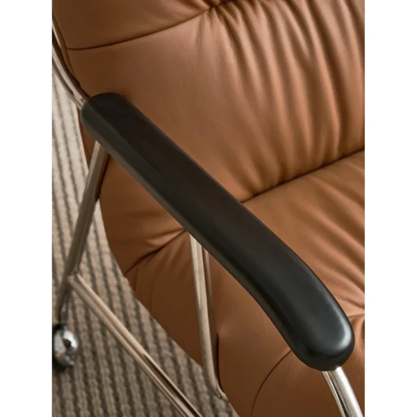 S-Curve Lounge Chair in Cognac Leather on Steel Frame — in a room setting