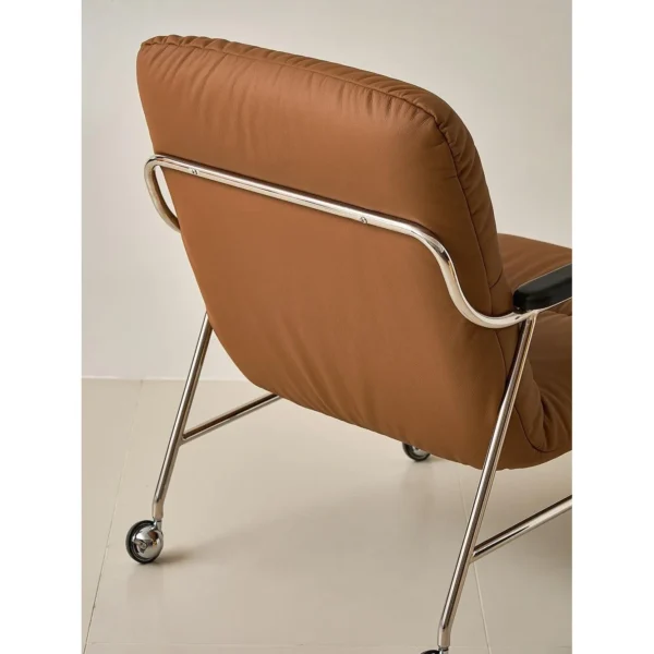 S-Curve Lounge Chair in Cognac Leather on Steel Frame — in a room setting