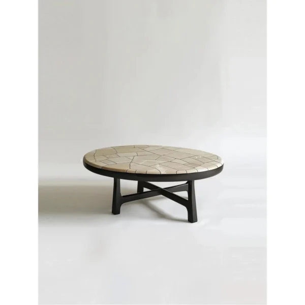 Huajing Round Coffee Table with Cracked Stone Mosaic Top in oatmeal — in a room setting