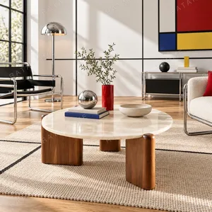 Ice Age Marble Round Coffee Table on Walnut Legs in oatmeal — in a room setting