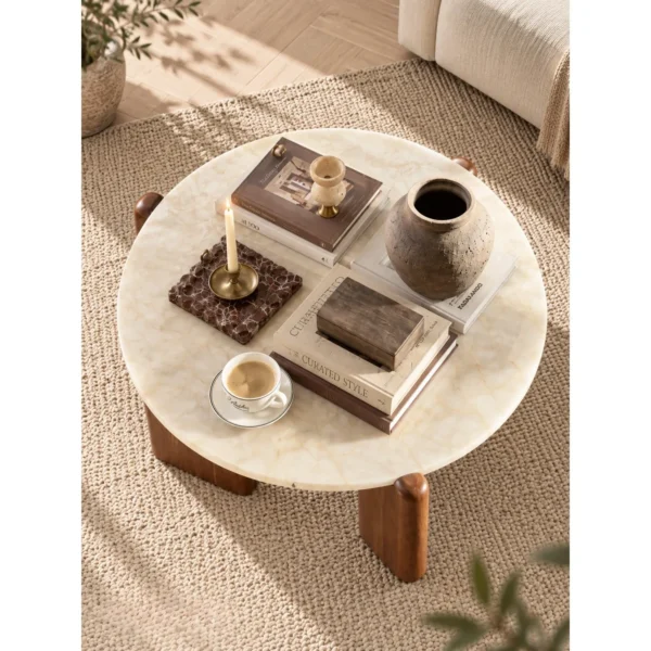 Ice Age Marble Round Coffee Table on Walnut Legs in oatmeal — in a room setting