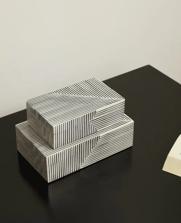 Black and White Line-Pattern Decorative Boxes in black — in a room setting