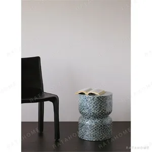 Blue Scale Capiz Shell Hourglass Side Table Stool in blue — in a room setting