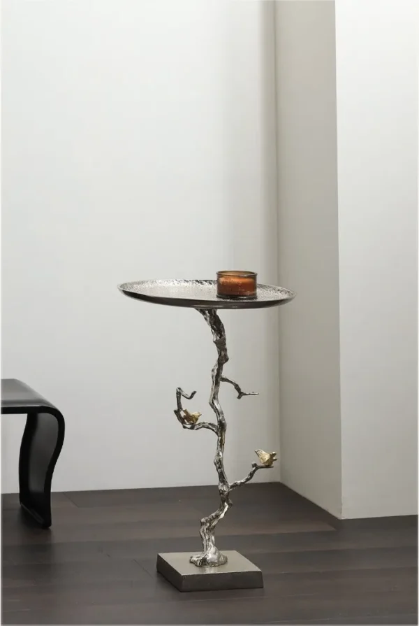Moonlight Branch Cast Aluminium Side Table with Birds in silver — in a room setting