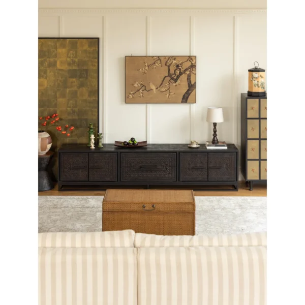 Hena Teak TV Cabinet with Hand-Carved Doors and Drawers in black — in a room setting