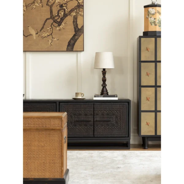 Hena Teak TV Cabinet with Hand-Carved Doors and Drawers in black — in a room setting