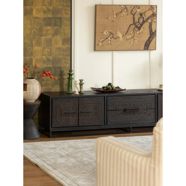 Hena Teak TV Cabinet with Hand-Carved Doors and Drawers in black — in a room setting