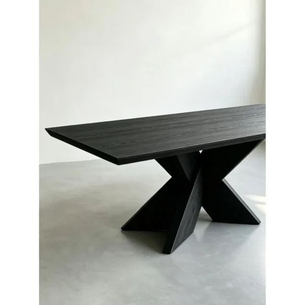 Ink-Dyed Carbonised Ash Dining Table with X Base in black — in a room setting