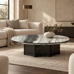 Round Panda White Marble Coffee Table in ivory — in a room setting
