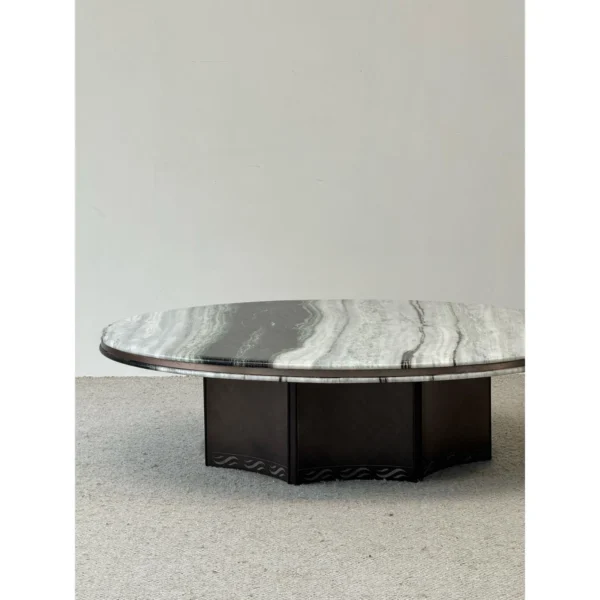 Round Panda White Marble Coffee Table in ivory — in a room setting