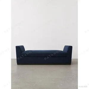 Quiet Luxury Daybed in Navy Fabric with Dark Wood Base — in a room setting