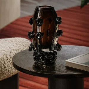 Hand-Made Amber Glass Vase with Black Studs in clay — front view