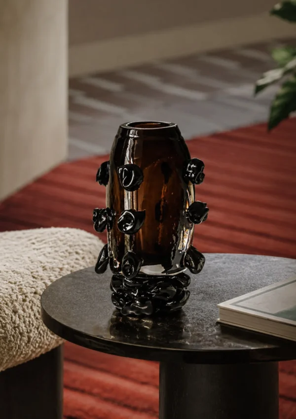 Hand-Made Amber Glass Vase with Black Studs in clay — in a room setting