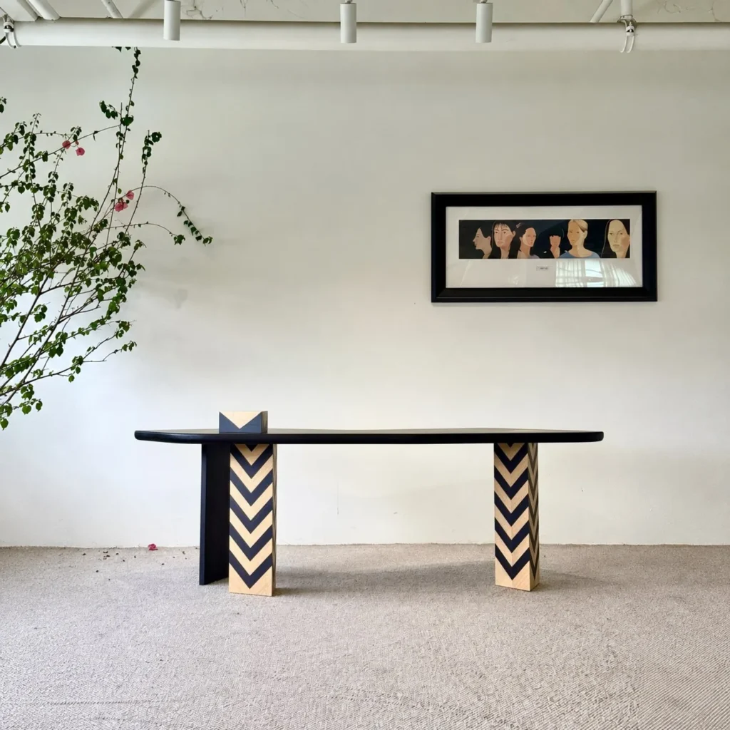 Curved Black Art Desk with Chevron Marquetry Legs in black — front view