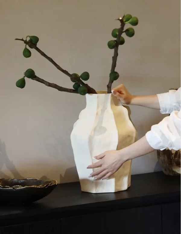 Designer Faceted Sand-Texture Ceramic Vase in mustard — in a room setting