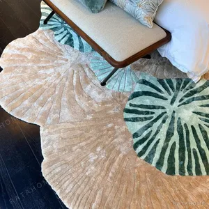 Irregular Lotus Leaf Hand-Tufted Rug in Green and Sand — in a room setting