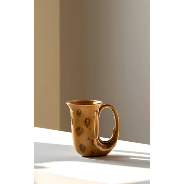 Hand-Made Speckled Ochre Ewer Vase in mustard — in a room setting