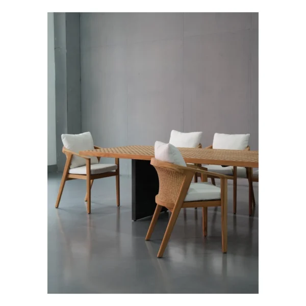 Teak Lattice Outdoor Table in natural oak — in a room setting