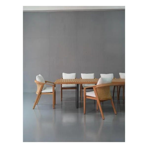 Teak Lattice Outdoor Table in natural oak — in a room setting