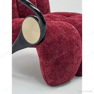 Italian Sculptural Lounge Chair in burgundy — in a room setting