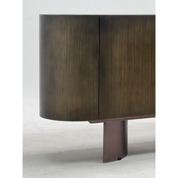 Brushed Bronze Oval Sideboard with Stone Top in bronze — in a room setting