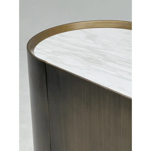 Brushed Bronze Oval Sideboard with Stone Top in bronze — in a room setting