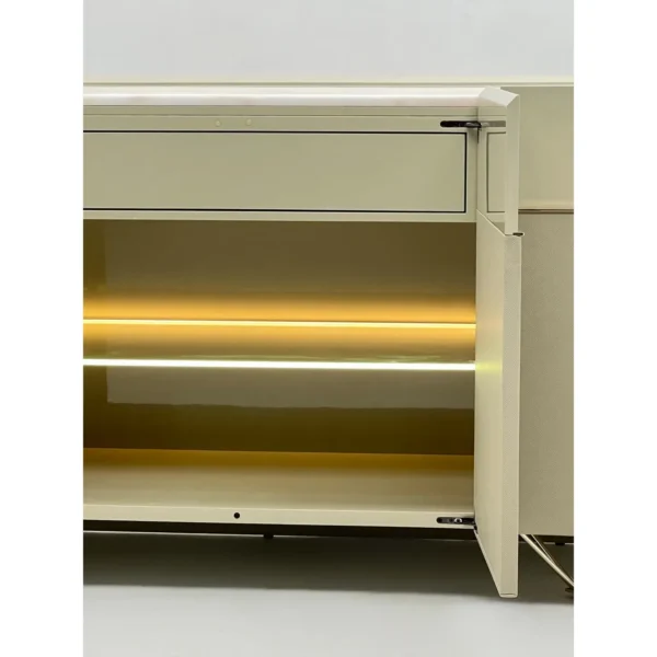Curved Beige Sideboard with Stone Top on Slim Metal Legs in sand — in a room setting