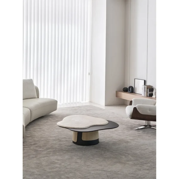 Cloud Travertine Coffee Table on Grey Sculpted Base in oatmeal — in a room setting