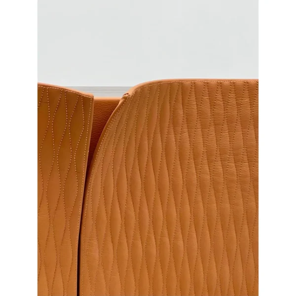 Caramel Leather Wave-Quilted Tall Wine Cabinet in clay — in a room setting