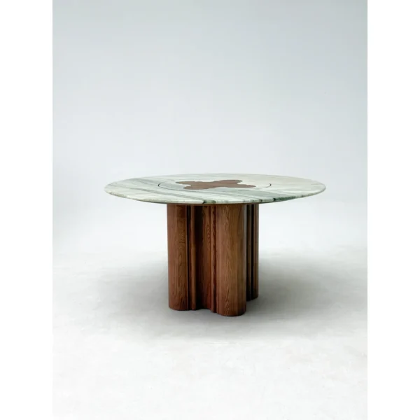 Green Stone Round Dining Table on Bent-Wood Wave Base in olive — in a room setting