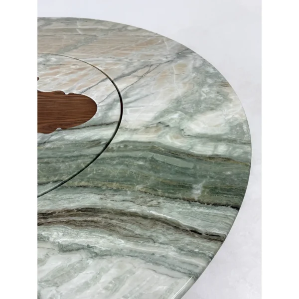 Green Stone Round Dining Table on Bent-Wood Wave Base in olive — in a room setting